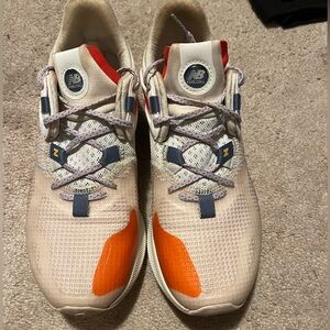 New Balance. Fuel Cell propel rmx v1. Orange, cream, white. Size 9.5 WOMENS